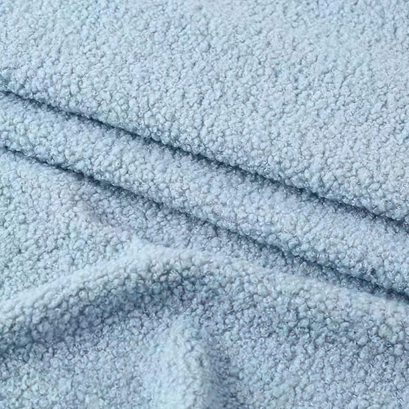 Close-up of boucle fabric showing looped texture