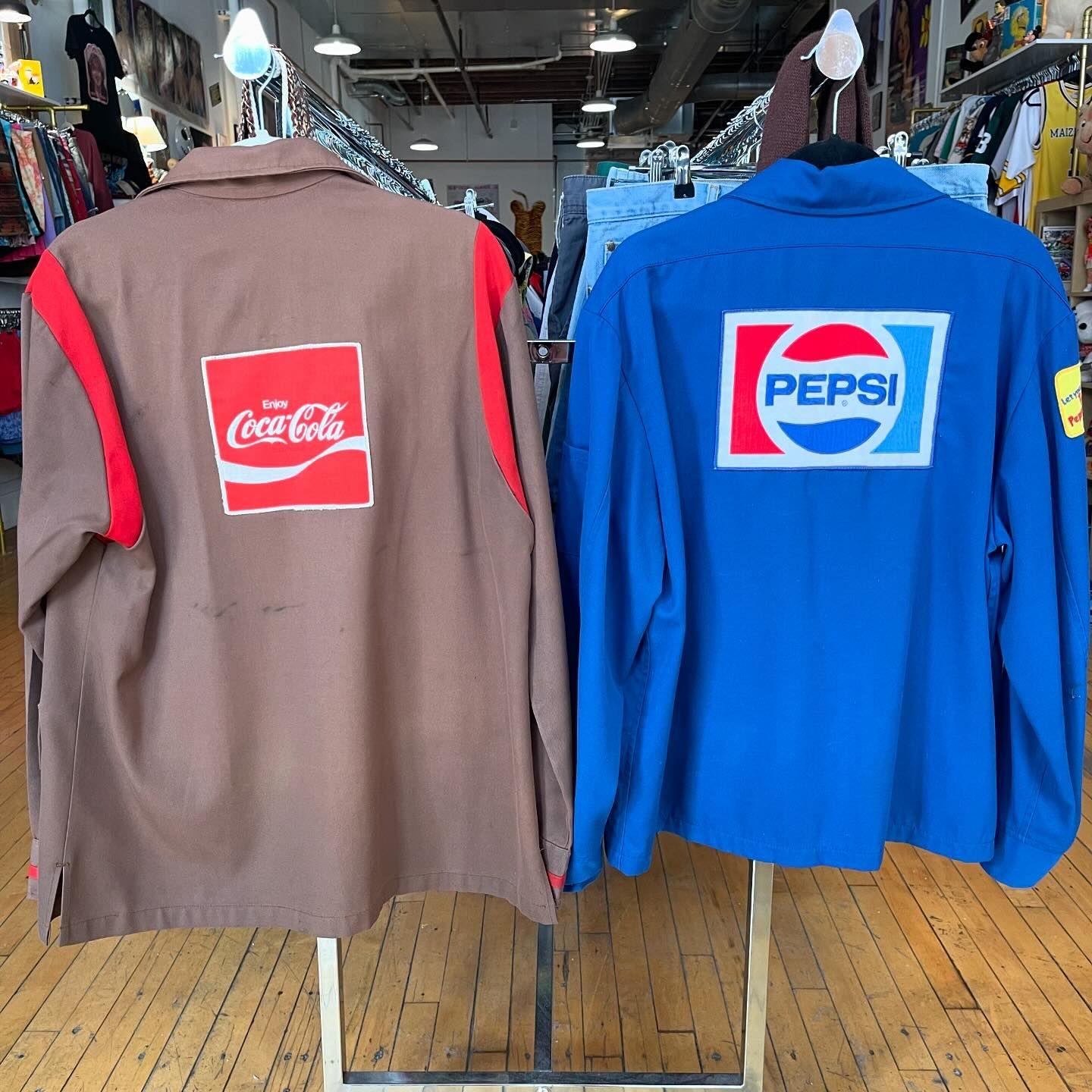 Vintage Coke or Pepsi work shirts on a rack